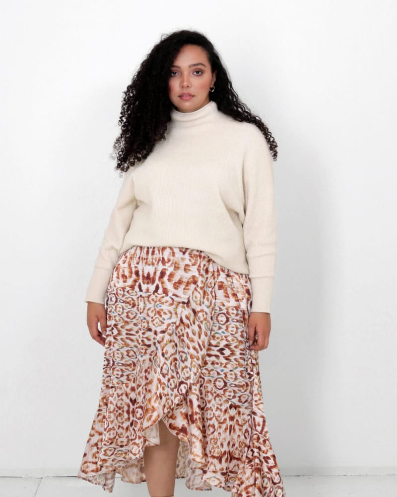 Front of a model wearing a size L (12/14) Juliette Wrap Skirt in Snow Leopard by LuvMeMore. | dia_product_style_image_id:266746